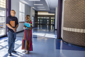 People talking in school hallway